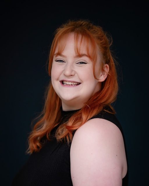 Professional headshot of Jess Latham smiling